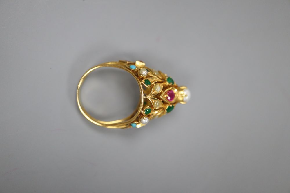 A modern yellow metal and multi gem set cocktail ring, size O/P, gross 11.5 grams.